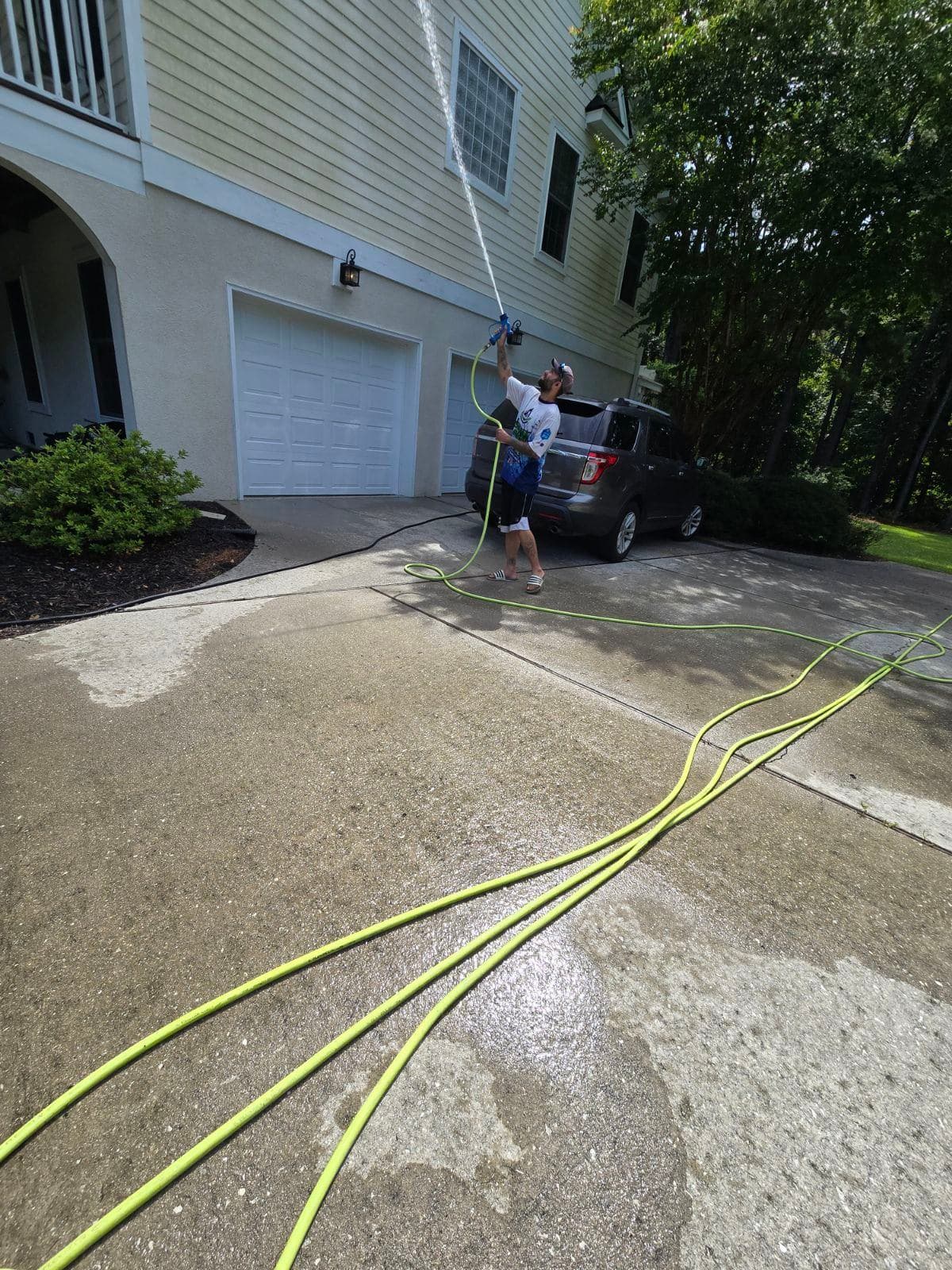 Pressure Washing Tall Residential Walls image